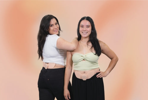 Two Girls Using Sens.U's Period Cramp Relief Device