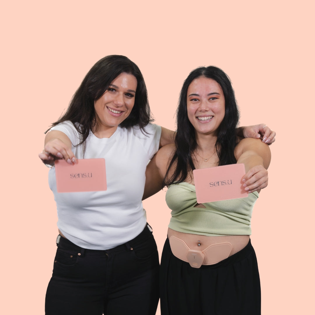 Two Female Models Holding Sens.U Wing Plate